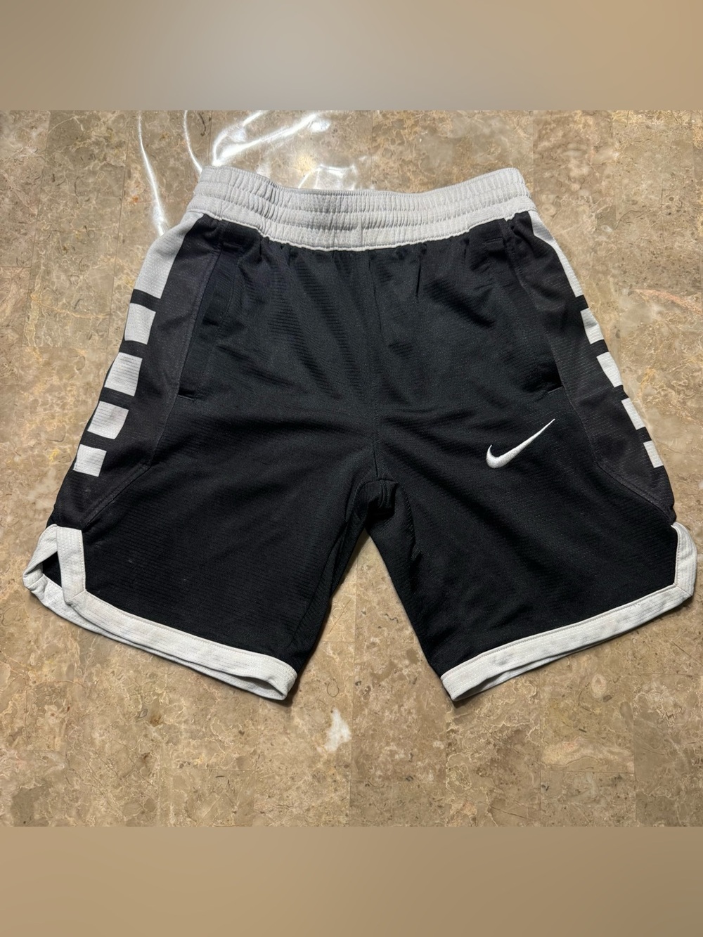 Nike Boy's Dri-FIT Elite Stripe Basketball Shorts in black and white size small